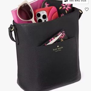 Black small bucket Kate Spade crossbody purse.